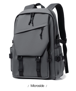 Detail of the high-capacity laptop backpack featuring durable fabric and side storage pockets