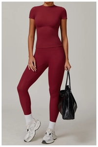 Close-up of wine red yoga set with short sleeve top and high waisted leggings