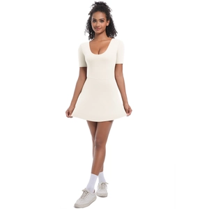 Detail of light beige tennis bodysuit dress with round neck and pleated A-line skirt