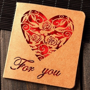 Creative vintage kraft paper card with red heart hollow design and For You lettering