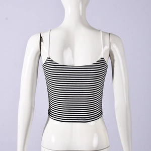 Detail of backless knit camisole featuring black and white horizontal stripes and thin straps