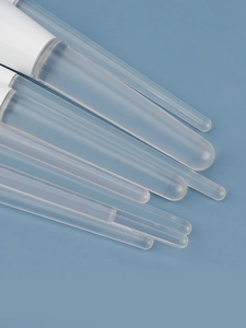 Macro shot of 10 gradient blue makeup brushes with diverse bristles on sky blue background