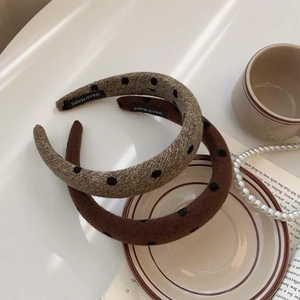 Vintage polka dot sponge headband in brown and beige colors with a handmade label