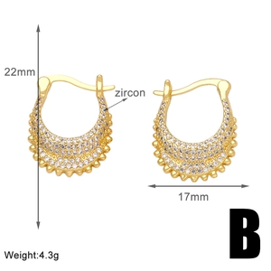 Detail view of gold triangle hoop earrings with dimensions 22mm x 17mm and pavé zircons