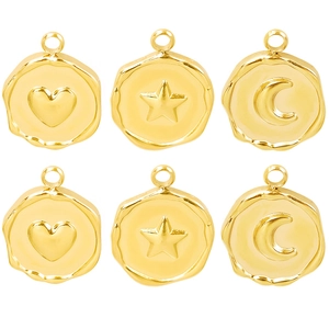 Close-up of six gold-plated stainless steel pendants in heart, star and moon wax seal designs