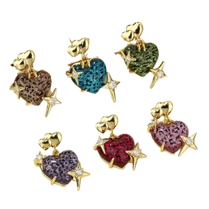 Set of six pairs of heart-shaped earrings in colorful resin with star motifs and gold metal