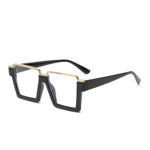 Fashionable oversized square eyeglasses frame in black and gold with geometric metal bridge
