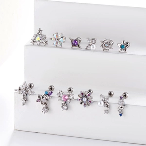 Silver stainless steel stud earrings with flower star designs and sparkling zircon stones