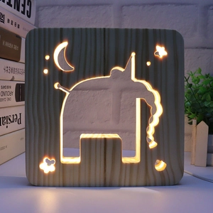 Detailed view of hollow wooden 3D night light with carved elephant and moon pattern