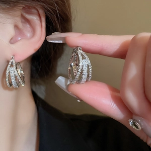 Luxurious layered geometric hoop earrings with sparkling cubic zirconia in silver finish