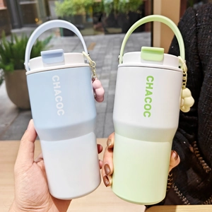 Close-up of portable vacuum flask with matte finish and wide handle for easy carrying