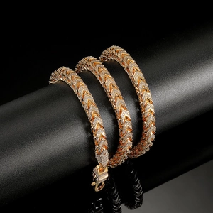 Macro shot of gold zircon chain with lock clasp showcasing detailed craftsmanship and sparkle