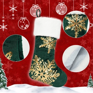 Detail view of green velvet Christmas stocking with gold sequin snowflake embroidery