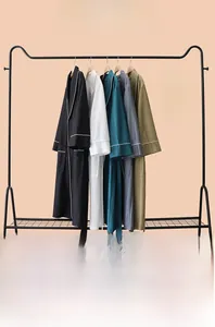 Detail of vertical striped cooling bathrobe with contrast piping and waist tie strap