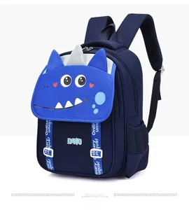 Detail view of deep blue dinosaur backpack showing 3D horns and side mesh pocket