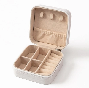 White faux leather jewelry travel case with soft velvet lining and ring organizers