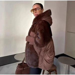 Detail of brown faux fur jacket featuring ribbed cuffs and quilted texture