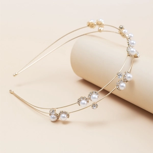 Elegant gold double-layered metal headband featuring white pearls and clear rhinestones