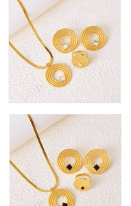 Detailed close-up of golden jewelry set with circular pendants and square gems