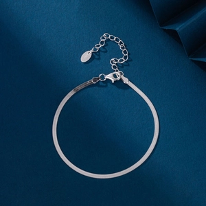 Detail of 925 sterling silver flat snake chain bracelet with lobster clasp and S925 tag