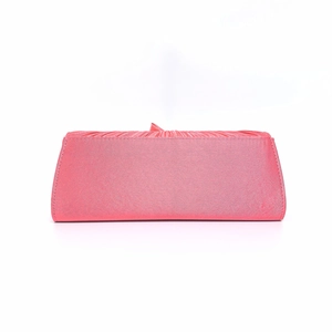 Detail view of the elegant pink satin fabric with pleated texture on the evening clutch bag