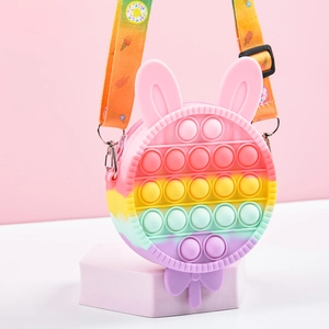 Rainbow lollipop pop-it fidget backpack with bunny ears and silicone stress relief design
