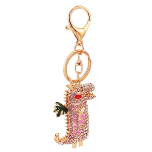 Porte-clés dinosaure en strass rose avec ailes en émail vert sur base en métal doré