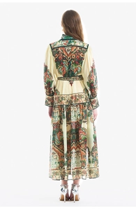Full back view of bohemian paisley print maxi dress with puff sleeves and ruffled hemline