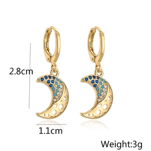 Detail view of 18K gold crescent moon earrings with zircon inlay and dimensions