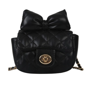 Quilted mini crossbody bag with a large bow detail and gold clasp on white background