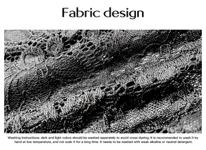Close-up macro of black lace fabric texture and detailed washing instructions on white background