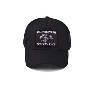 Detail of black trucker hat featuring 'Women Want Me Fish Fear Me' embroidery patch