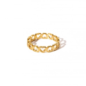 Close-up of a polished gold-plated hollow heart-shaped band ring with mirror finish