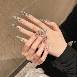 Long stiletto press-on nails featuring silver metallic 3D rose and vine gothic motifs