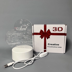 Macro shot of 3D acrylic heart lamp with aunt gift message and white USB base