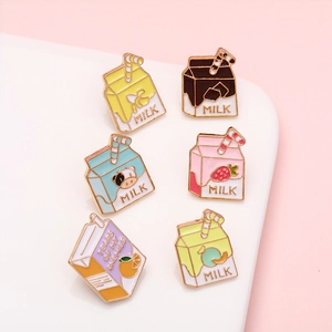 Collection of creative milk carton enamel pins in various flavors and vibrant colors