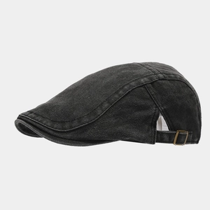 Detail view of washed denim ivy cap featuring vintage texture and metal buckle