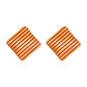 Macro view of square gold earrings featuring stylish diagonal red stripes and texture