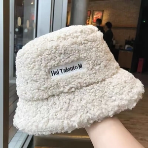 Winter fluffy faux lamb wool bucket hat in creamy white with small label decoration