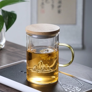 Glass tea cup with wooden lid and mountain-shaped base featuring a floating flower