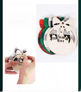 Detail of wooden Christmas ornaments with festive plaid patterns and hollow house designs