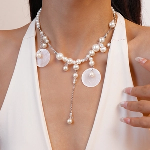 Elegant pearl and shell tassel necklace for beach vacation style with silver chain
