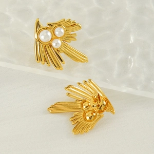 Irregular 18K gold-plated wing earrings with three white pearls on a soft background