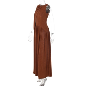 Detail view of brown sleeveless maxi dress featuring elegant ruched texture and slim fit