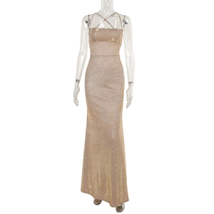 Detailed view of the sparkling gold sequin fabric on a slim-fit backless evening dress