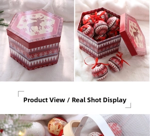 Close-up of a red hexagonal Christmas gift box with patterned ornaments and velvet decor