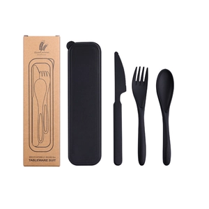 Close-up of portable wheat straw cutlery set with black storage box and eco-packaging