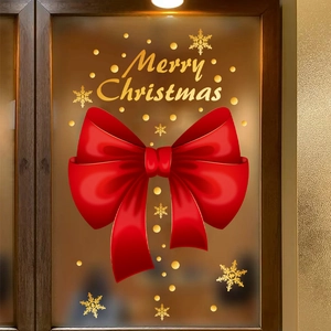 Christmas window decals with large red bow and gold Merry Christmas text on glass door