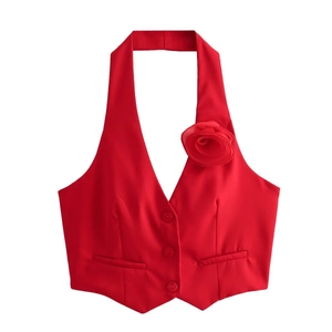 Detail of red halter vest with a large 3D rose decoration and three single-breasted buttons