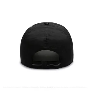 Detail view of the breathable mesh fabric and adjustable rear strap of this black outdoor cap